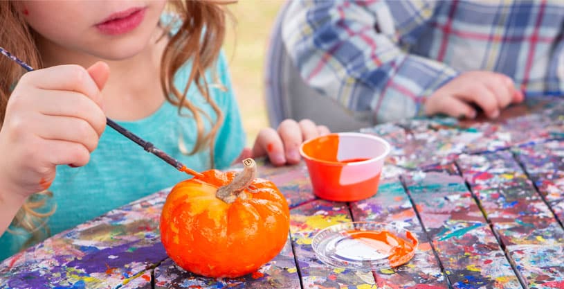 Pumpkin Painting Activity during Parade of Pumpkins